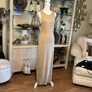 I am selling a Lon beigh dress slit on the left side sleeveless new with tag